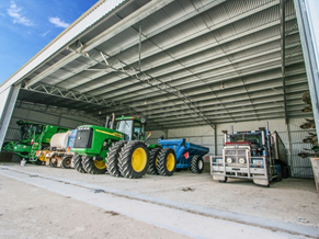 Tractors neatly in a shed as a pictorial representation of SJ dependable personality type