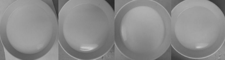 Four bowls of soymilk produced from different types of soybean.