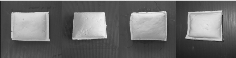 Four chunks of tofu produced from different types of soybean.